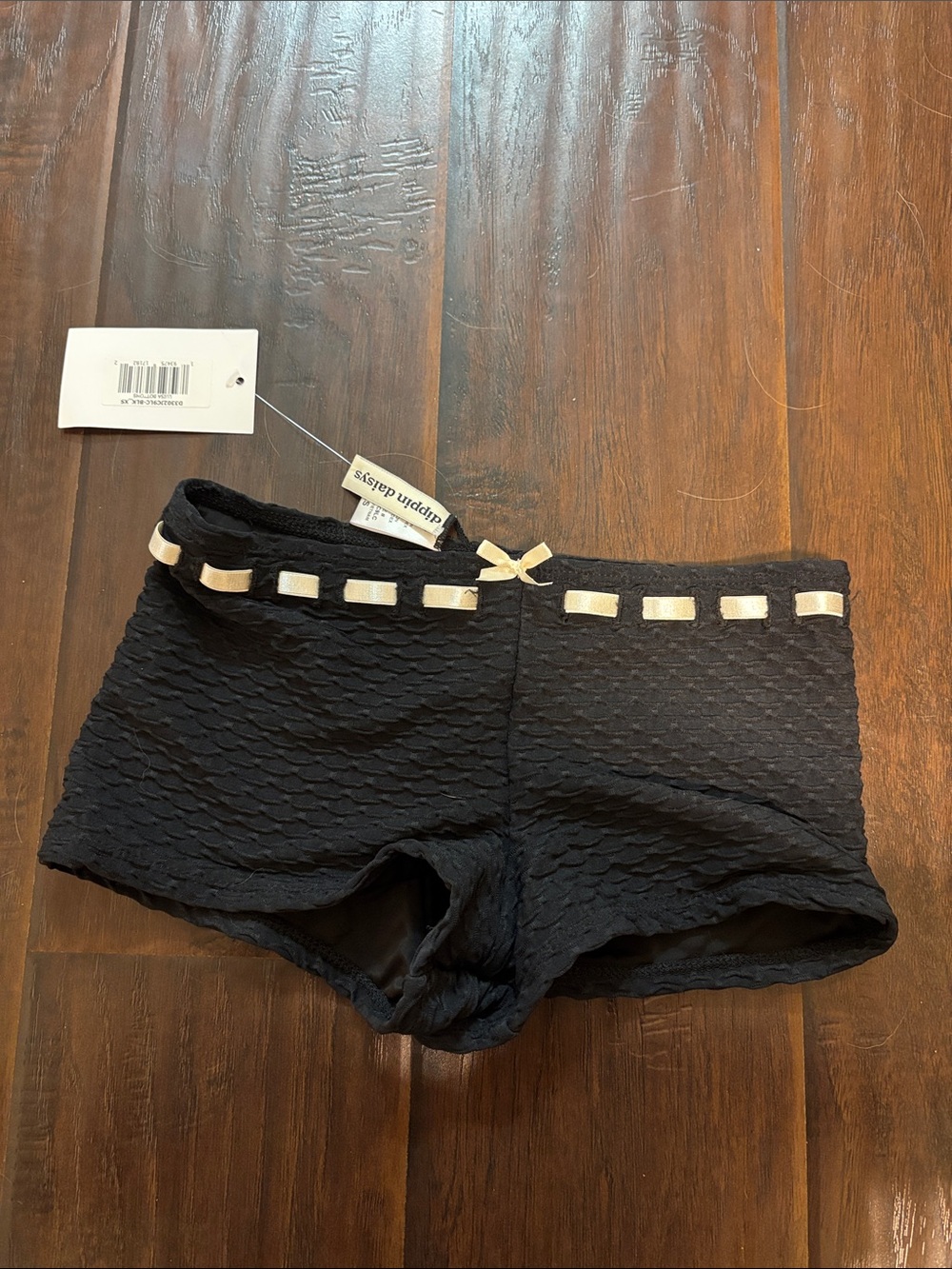 Dippin' Daisy's Black Textured Swim Shorts with Cream Ribbon